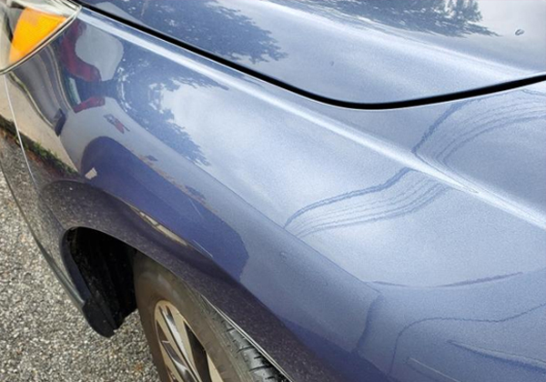 dent in a car after fixing